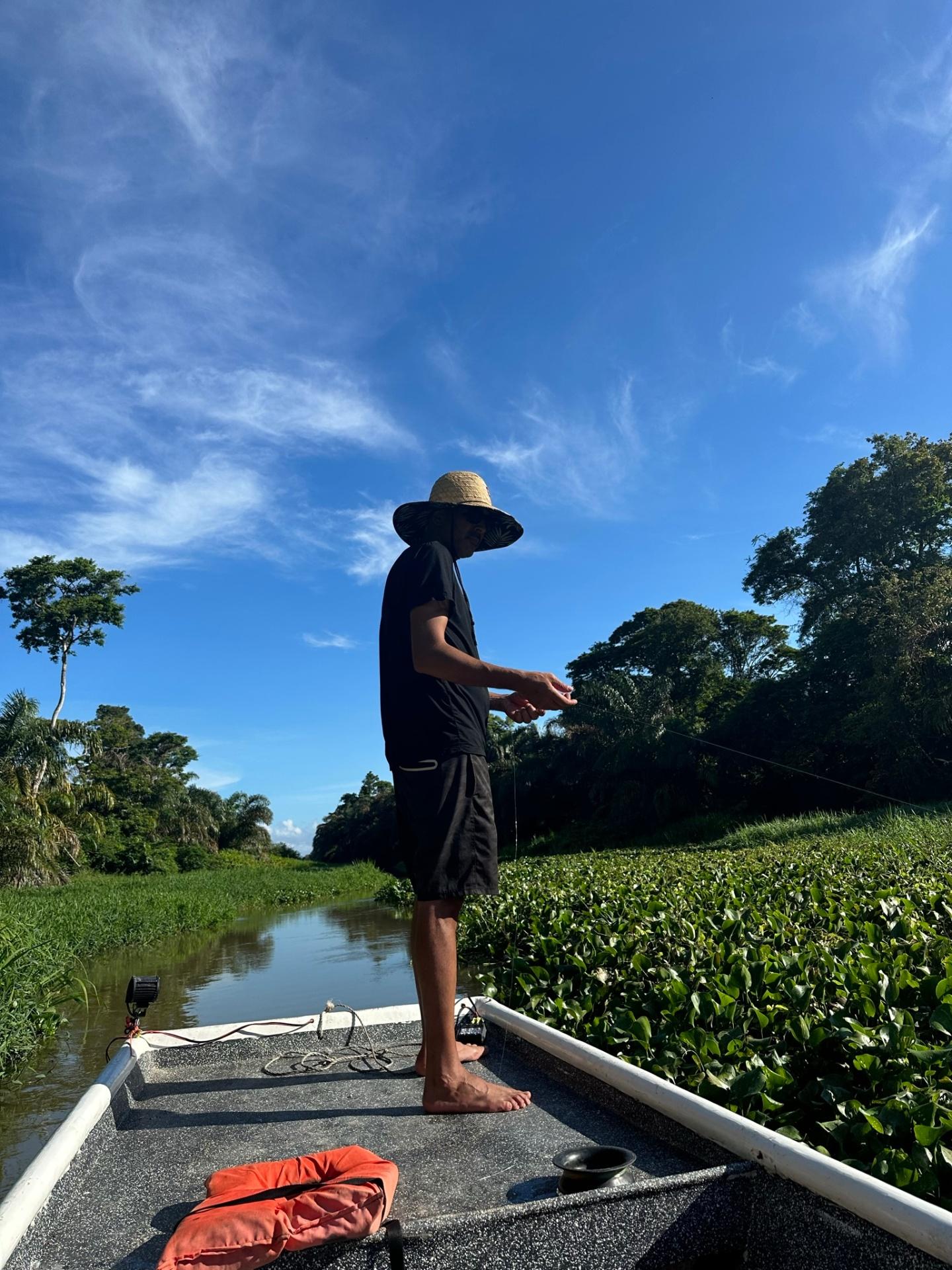 Local guide casting a line on the Tortuguero river